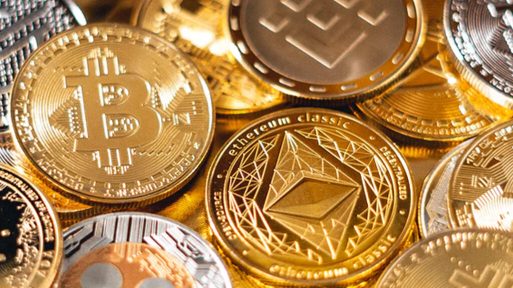 a bunch of gold coins with crypto logos on them