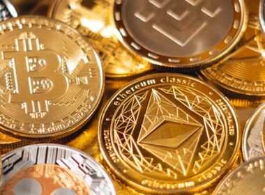 a bunch of gold coins with crypto logos on them