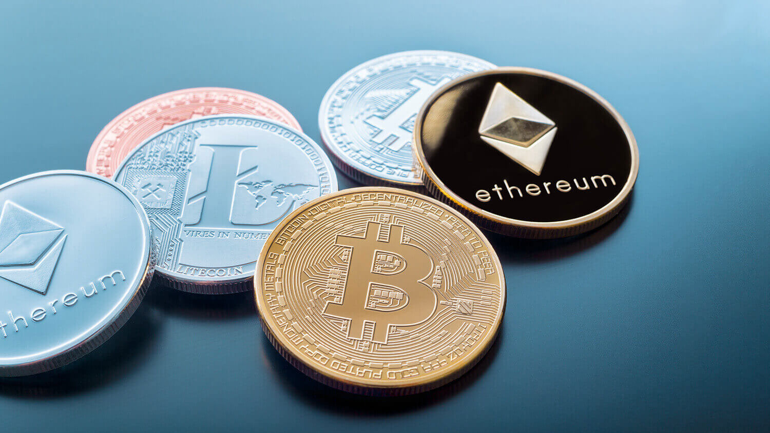 a few coins with crypto logos on them