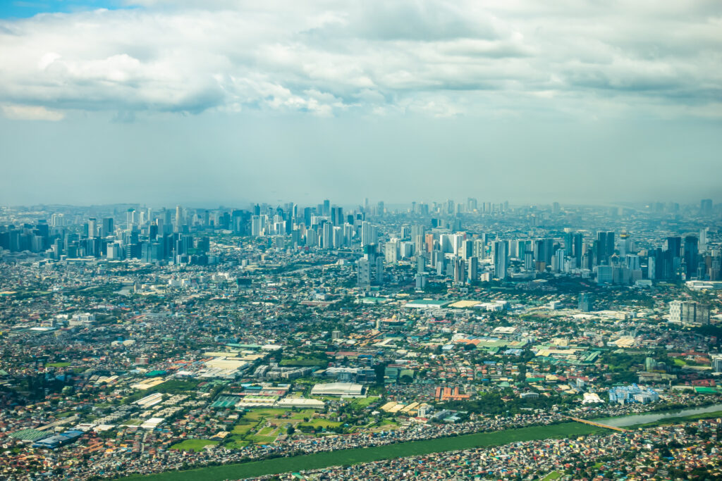 Aerial panoramic cityscape view of central Metro Makati Manila city in Philippines in daytime. 