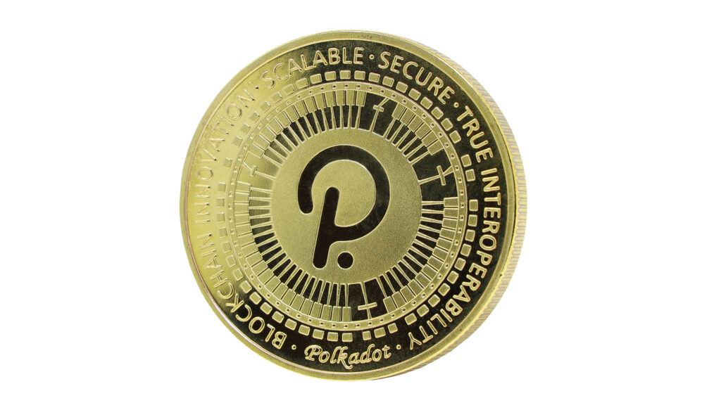 A gold coin with the Polkadot logo embossed onto it.