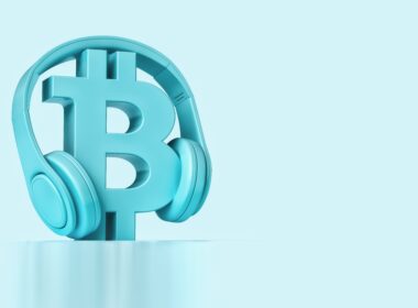 A blue 3D rendered Bitcoin logo with blue headphones on it.