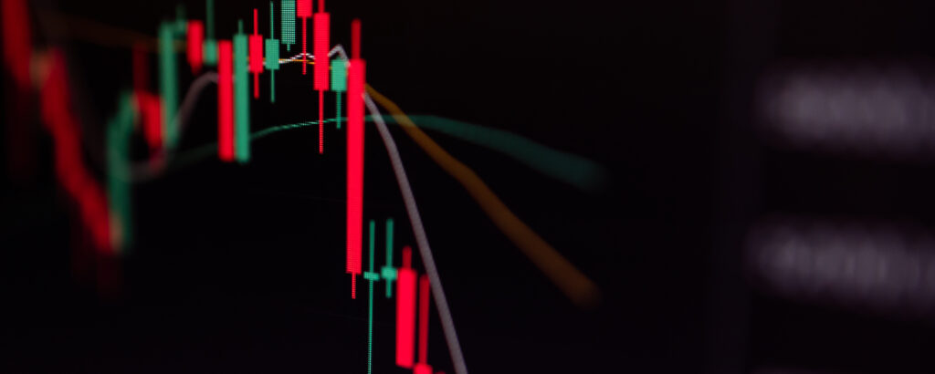 Close up of Bitcoin and Cryptocurrency stock market exchange candlestick chart. Red bearish divergence indicator