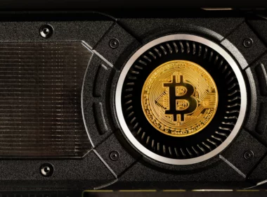 a gold bitcoin inside a mining machine