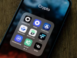 a folder is open on the screen of an iphone. on it, there are nine apps, all of them are various ways to either trade or stake crypto.