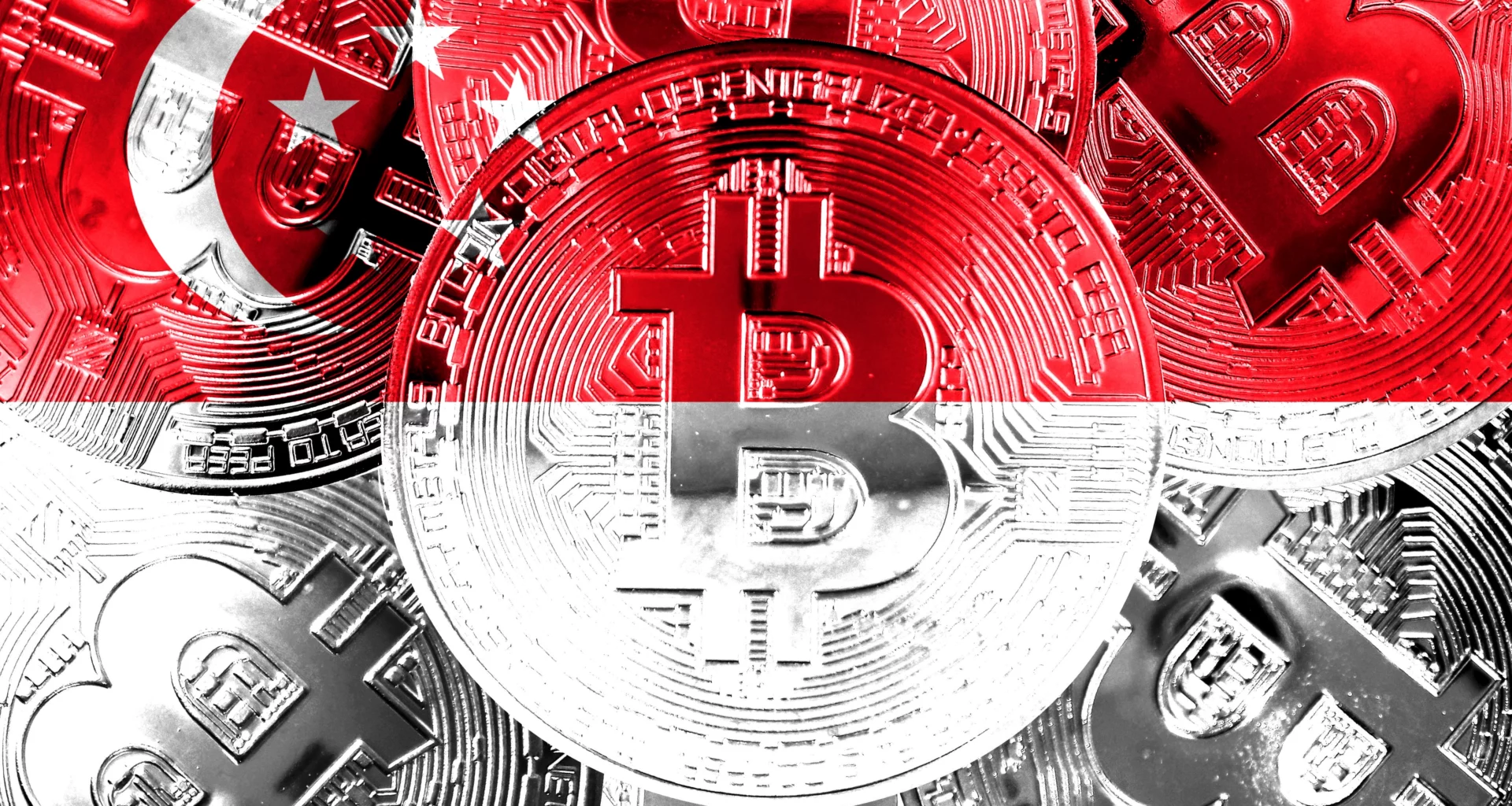 physical bitcoins coloured to resemble the Singapore flag