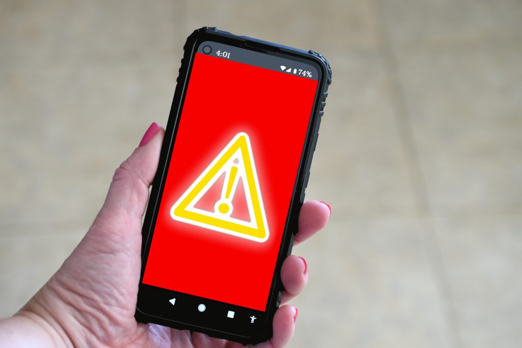 Phone screen showing a red warning screen.
