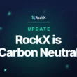 Dark blue background with teal triangles in the foreground and text reading "Update: RockX is Carbon Neutral".